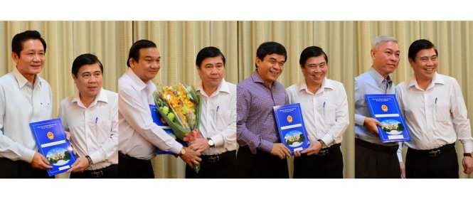 (Từ trên xuống, trái qua): Ông Nguyễn Thành Phong - Chủ tịch UBND TP.HCM trao quyết định cho ông Trần Trung Dũng - giám đốc Sở Lao động – thương binh và Xã hội TP.HCM nhận công tác tại Ban Tổ chức Thành ủy; Ông Nguyễn Thành Phong - Chủ tịch UBND TP.HCM trao quyết định cho ông Lê Minh Tấn - Bí thư Huyện ủy huyện Củ Chi giữ chức Giám đốc Sở Lao động - thương binh và Xã hội TP.HCM; Ông Nguyễn Thành Phong - Chủ tịch UBND TP.HCM trao quyết định cho ông Nguyễn Qúy Hòa - Tổng giám đốc Đài Truyền hình TP.HCM nhận công tác tại Ban Tuyên giáo Thành ủy; Ông Nguyễn Thành Phong - Chủ tịch UBND TP.HCM trao quyết định cho ông Nguyễn Pôn - Trưởng phòng Tổ chức-Văn phòng Thành ủy TP.HCM giữ chức phó tổng giám đốc Tổng công ty xây dựng Sài Gòn TNMTV.
