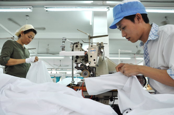 Sản xuất hàng dệt may xuất khẩu tại Công ty CP may Bình Minh - Ảnh: T.V.N.