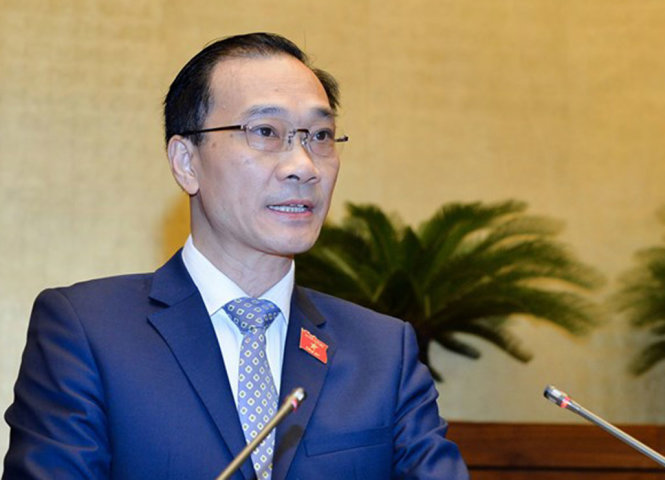 Chủ nhiệm Ủy ban Kinh tế Vũ Hồng Thanh báo cáo giải trình, tiếp thu ý kiến đại biểu Quốc hội trước khi Quốc hội biểu quyết thông qua nghị quyết - Ảnh: Cổng TTQH