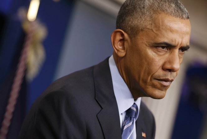 Tổng thống Barack Obama tham dự buổi họp báo cuối cùng tại Nhà Trắng ngày 16-12 trước khi cùng gia đình đi nghỉ lễ Giáng sinh - Ảnh: Reuters