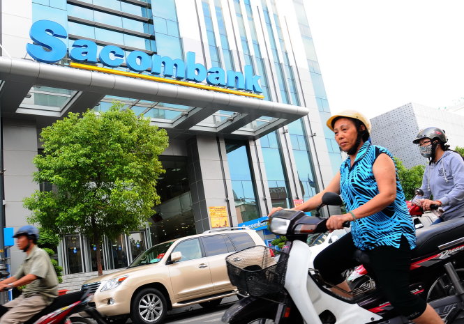Sacombank trích dự phòng để xử lý nợ xấu. Trong ảnh: trụ sở của ngân hàng này tại TP.HCM - Ảnh: T.T.D.