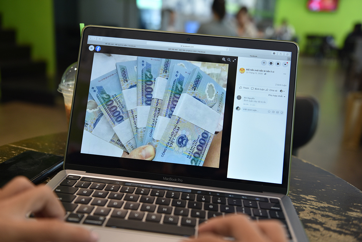 Ngân hàng báo không có tiền mới, nhưng lên mạng đổi bao nhiêu cũng có - Ảnh 1. Ngân hàng báo không có tiền mới, nhưng lên mạng đổi bao nhiêu cũng có - Ảnh 1.