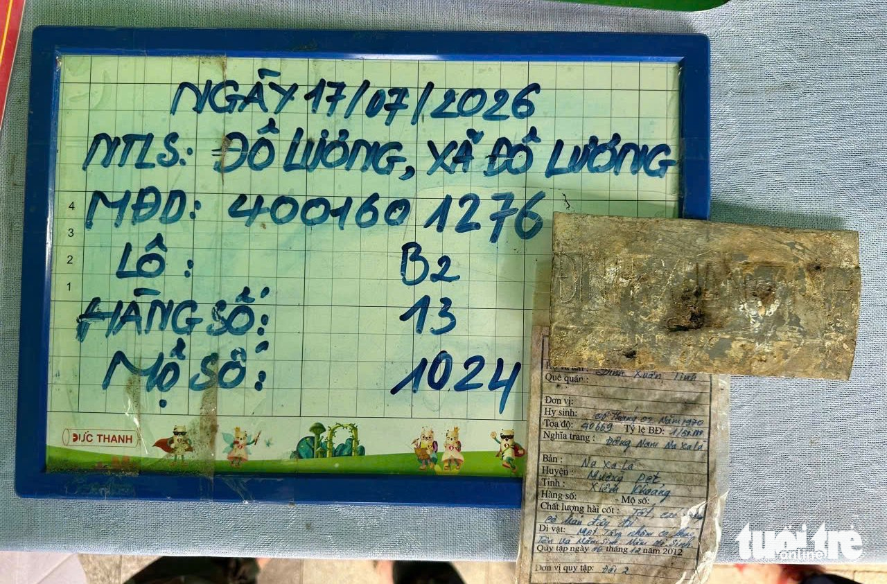 Mảnh nhôm khắc 'Đinh Xuân Tình' trong mộ liệt sĩ - Ảnh 2.