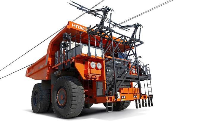 Xe ben điện sử dụng pin và có thể vừa chạy vừa sạc nhờ hệ thống dây cáp trên cao.