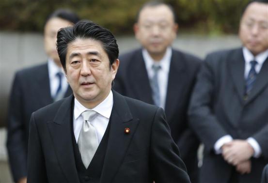 Japan's Prime Minister Shinzo Abe arrives at the controversial Yasukuni Shrine to pay tribute to the war dead, in Tokyo December 26, 2013. REUTERS-Yuya Shino