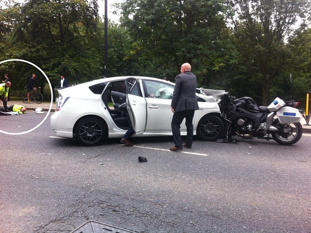 Prince Harry was caught up in a dramatic high speed crash yesterday when one of his police outriders smashed head on into a taxi