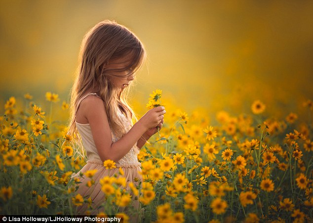 Delicate: Ms Holloway takes most of her photos outside, and manages to expertly portray each of her childrens unique characters. Pictured, Octavia, five