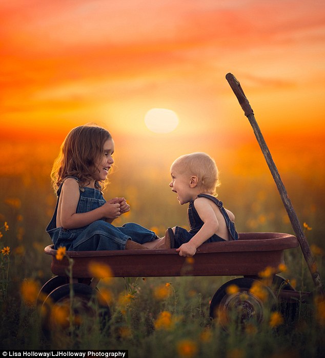 Off-guard: She also says that the best portraits are often the un-posed, un-planned ones. Pictured, Elliott and Gabriel