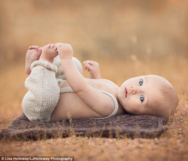 Hold still! Ms Holloway cites patience as the greatest lesson shes learned from photographing her family. Pictured, Gabriel
