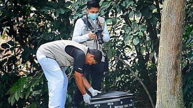 Thi thể người phụ nữ không đầu được phát hiện dưới một gốc cây tại bãi đậu xe khu vực Jalan Kebun Bunga. Ảnh: The Star