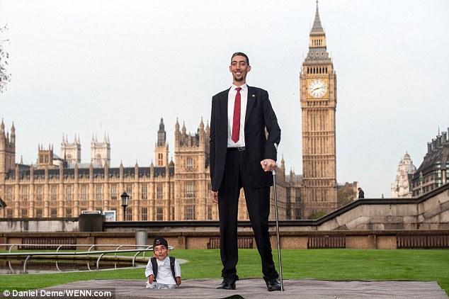 Mr Dangi, pictured with Mr Kosen today, was declared the shortest living adult human in 2012