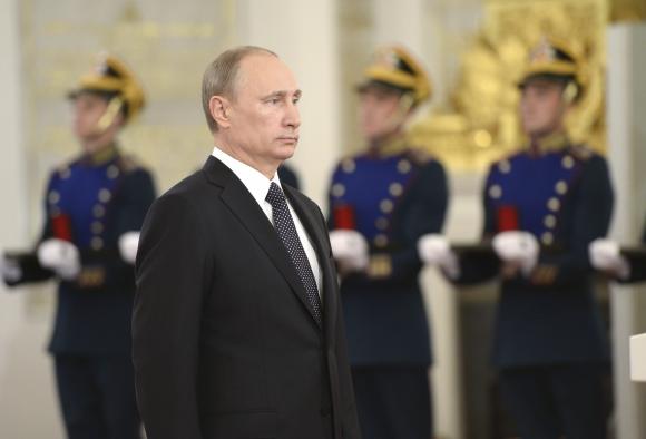 Tổng thống Nga Vladimir Putin đ&atilde; c&oacute; dấu hiệu hợp t&aacute;c giải quyết cuộc khủng hoảng tại Ukraine. Ảnh: Reuters