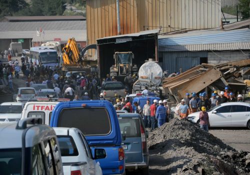 Rescue workers at the entrance of the mine after an explosion and fire at a coal mine in Soma, in western Turkey, Tuesday, May 13, 2014. An explosion and fire at a coal mine in western Turkey killed at least one miner Tuesday and left up to 300 workers trapped underground, a Turkish official said. Twenty people were rescued from the mine in the town of Soma in Manisa province but one later died in the hospital, Soma administrator Mehmet Bahattin Atci told reporters. The town is 250 kilometers (155 miles) south of Istanbul. TURKEY OUT Photo: IHA, AP / IHA