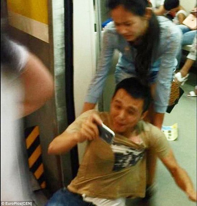 In you get: The woman finally drags her boyfriend inside the carriage as he continues to look at his phone