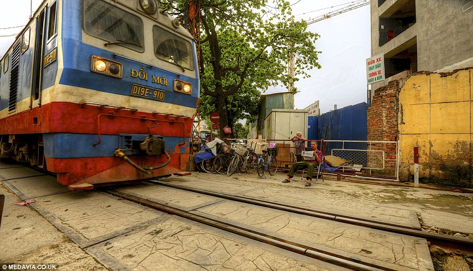 Watching on: The route in the centre of Hanoi, Vietnam, cuts through tight streets in the citys old town district, heading to Long Bien Bridge