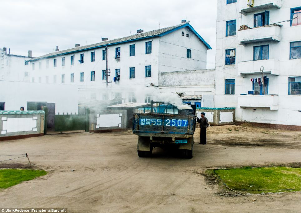 Hard at work: The regime in Pyongyang have previously banned photographers for taking images of people relaxing, but are keen to promote snaps of people at work to promote the country