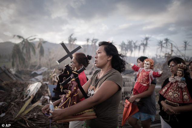 In this photo provided on Friday Feb. 14, 2014 by World Press Photo, the 1st prize in the Spot News Single category of the 2014 World Press Photo Contest by ...