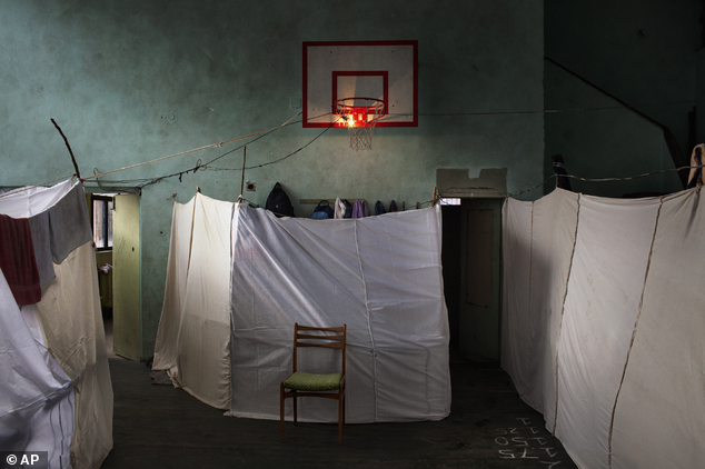 In this photo provided on Friday Feb.14, 2014 by World Press Photo, the 1st prize in the General News Single category of the 2014 World Press Photo Contest b...