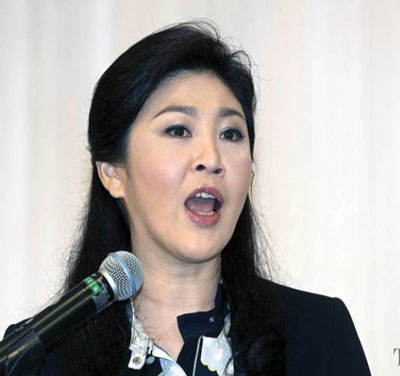 Bà Yingluck tuyên bố sẽ không bỏ chạy như anh trai. Ảnh: THE NATION