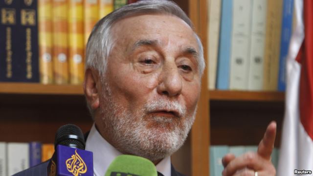 FILE - Bahjat Suleiman, Syrian ambassador to Jordan, gestures during a news conference at the Syrian embassy in Amman, May 22, 2013.