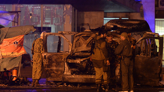 A blown-up minivan belonging to self-proclaimed People&rsquo;s Republic of Donetsk (DNR) leader Denis Pushilin sits near the local administration building in Donetsk. (RIA Novosti / Maxim Blinov)