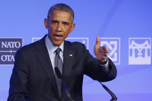U.S. President Barack Obama speaks at a news conference on the second and final day of the NATO summit at the Celtic Manor resort, near Newport, in Wales September 5, 2014. REUTERS/Yves Herman