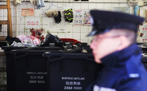Police were called after the body was discovered at the rubbish collection centre in Portland Street. Photo: May Tse