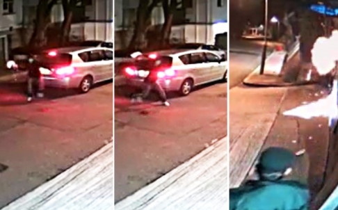 Kẻ phá hoại ném chai vào trước cửa nhà ông Lai. Hình ảnh lấy từ camera giám sát. Ảnh: SCMP