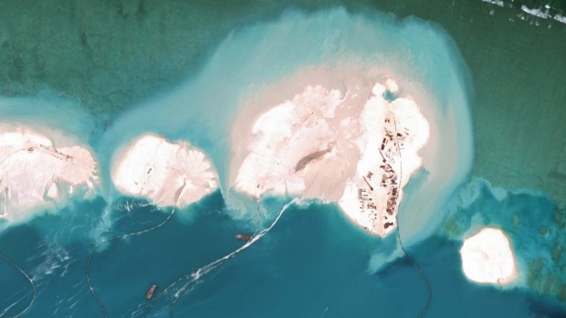 Dredgers working at the northernmost reclamation site of Mischief Reef, part of the Spratly Islands, in the South China Sea in March 2015.