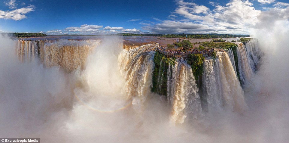 Iguazu Falls on the border of Brazil and Argentina: A cloud of vapor rises up from the fall which divides the lower and upper Iguazu River