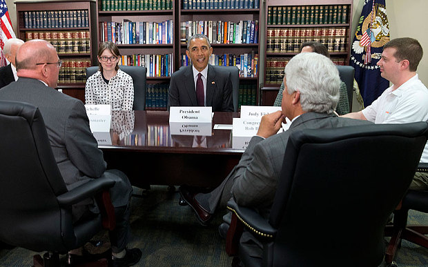President Barack Obama, centre, participates in a roundtable about clean energy with Judy Fisher, clockwise from Obama, Marvin Lance Futch, Rep. Rob Bishop, R-Utah, Harry