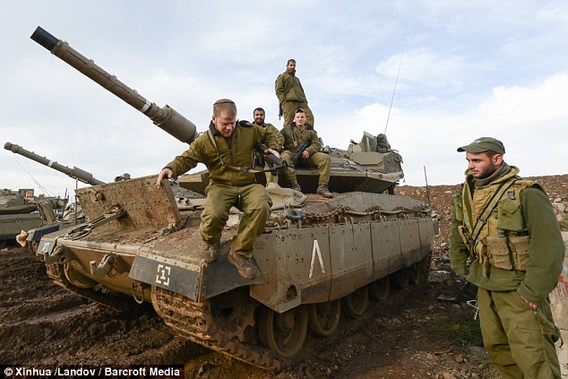 Top Hezbollah and Iranian commanders killed in an Israeli airstrike on Sunday were meeting to discuss a plan to invade Galilee, according to a former Israeli general (pictured, Israel deploys troops today)