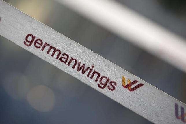 A barrier tape of German airline Lufthansas low-cost carrier Germanwings is pictured at a closed gate of Berlin Tegel airport August 29, 2014. REUTERS/Fabrizio Bensch