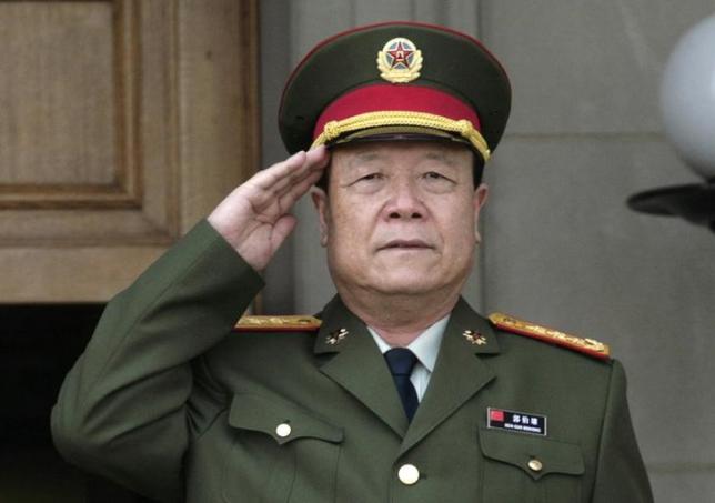 Chinas then-Central Military Commission former Vice Chairman General Guo Boxiong stands at attention during the playing of the national anthem before a meeting at the Pentagon in Washington July 18, 2006. REUTERS/Yuri Gripas