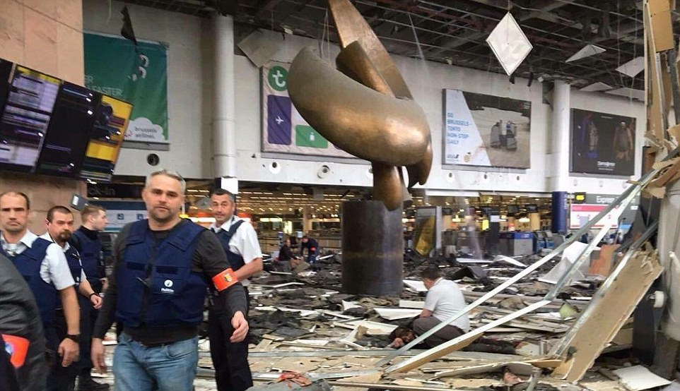 Carnage:&nbsp;At least eleven people have died and several  injured after two explosions rocked Brussels Airport in a suspected terror attack