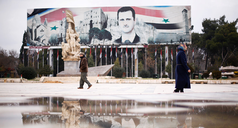 
H&igrave;nh ảnh Tổng thống Assad tại quảng trường Saadallah al-Jabri ở Aleppo chụp h&ocirc;m 17-12. Ảnh: Reuters
