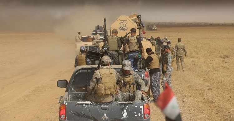 IS thảm sát ở Mosul, gạt xác người xuống mộ tập thể