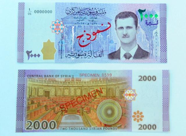 Syria in hình tổng thống Assad lên đồng nội tệ