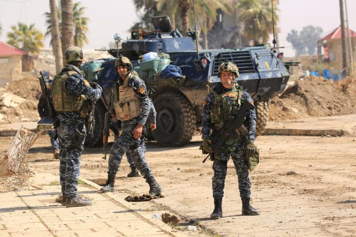 Lực lượng cảnh sát liên bang Iraq ở khu vực Bab al-Tob, Mosul - Iraq hôm 14-3. Ảnh: Reuters