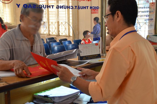 Kể từ ngày 5-12 có bắt buộc phải thay đổi sổ đỏ? - Ảnh 1.