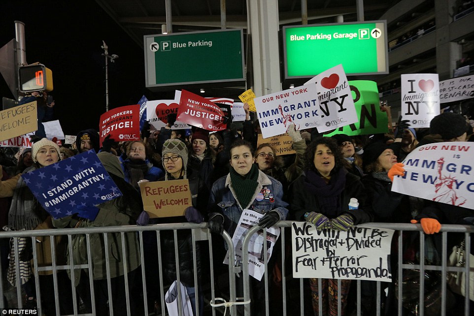 The massive demonstration carried on through Saturday evening as 11 out of 12 refugees remained held at JFK airport