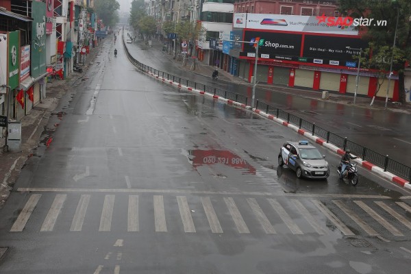 Không ồn ào vội vã, Sài Gòn - Hà Nội được trả lại vẻ yên bình trong ngày mùng 1 Tết - Ảnh 14.