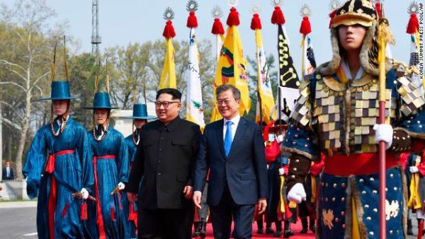 North Korean leader Kim Jong Un, left, and South Korean President Moon Jae-in walk together&Acirc;&nbsp;after he crossed into the southern side of the DMZ.