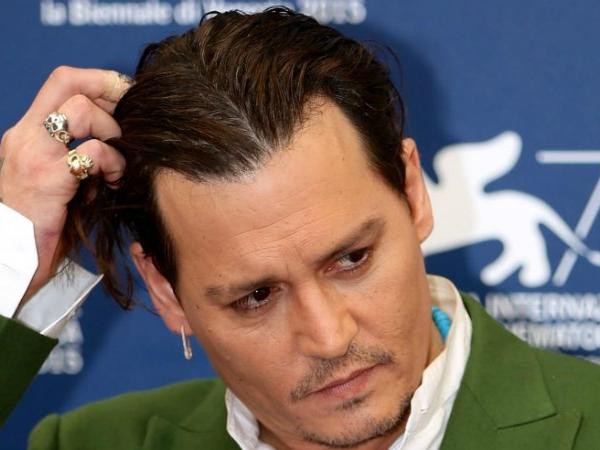 "Cướp biển" Johnny Depp dàn xếp êm vụ kiện 25 triệu USD
