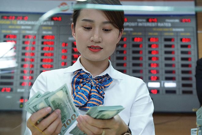 “Ứng xử” với tỉ giá thế nào trong cuộc chiến thương mại?