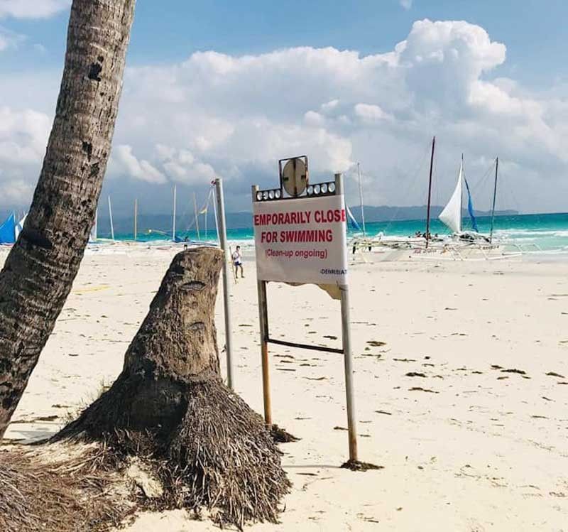 Kh&aacute;ch Trung Quốc ch&ocirc;n bỉm tr&ecirc;n c&aacute;t, Philippines đ&oacute;ng cửa b&atilde;i biển  - Ảnh 1.