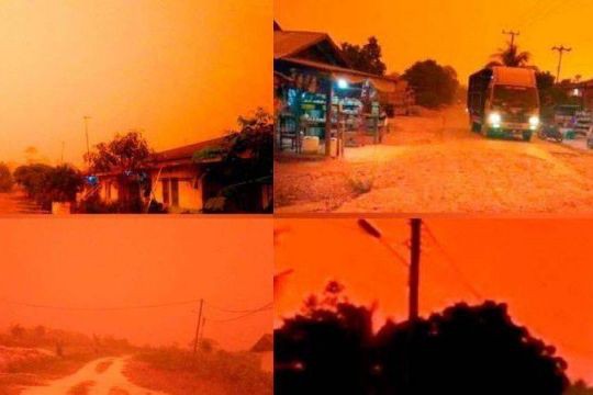 Kh&oacute;i m&ugrave; l&agrave;m bầu trời ở một tỉnh của Indonesia đỏ như m&aacute;u - Ảnh 1.