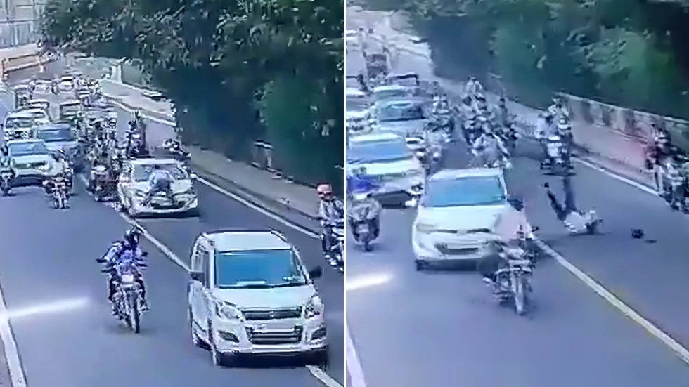 Tung mình lên nóc ca-pô, cảnh sát giao thông bị tài xế hất xuống đất bỏ chạy