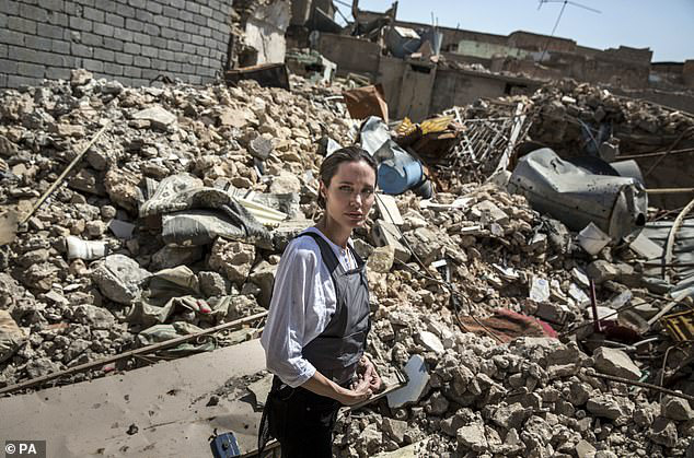 26417866-8153835-Around_the_world_Angelina_has_special_envoy_status_from_the_Unit-m-26_1585180401458