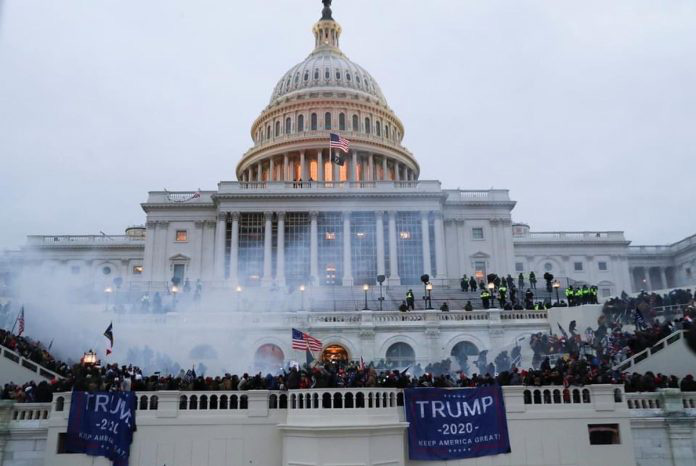 Đảng D&acirc;n chủ e ngại lịch sử lặp lại nếu &ocirc;ng Donald Trump được tha bổng - Ảnh 1.